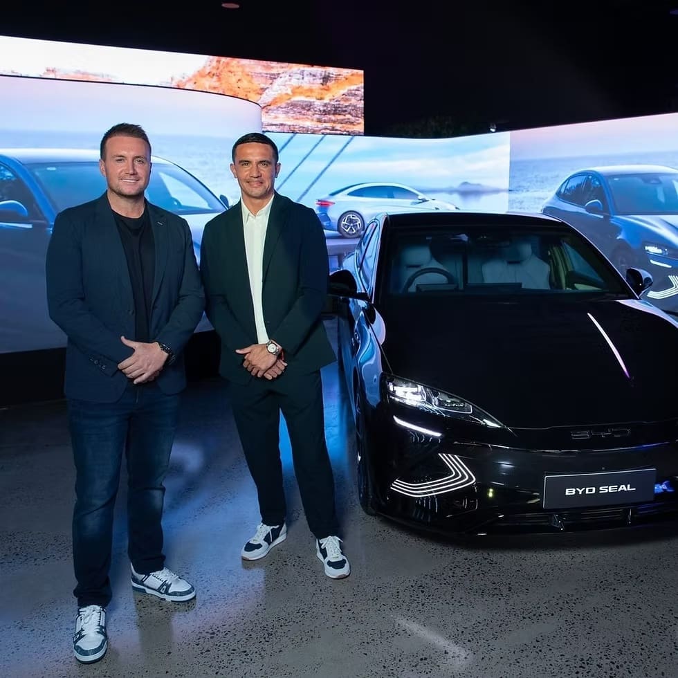 BYD Megastore display featuring LED signage and BYD Seal electric vehicle showcased under ambient lighting.