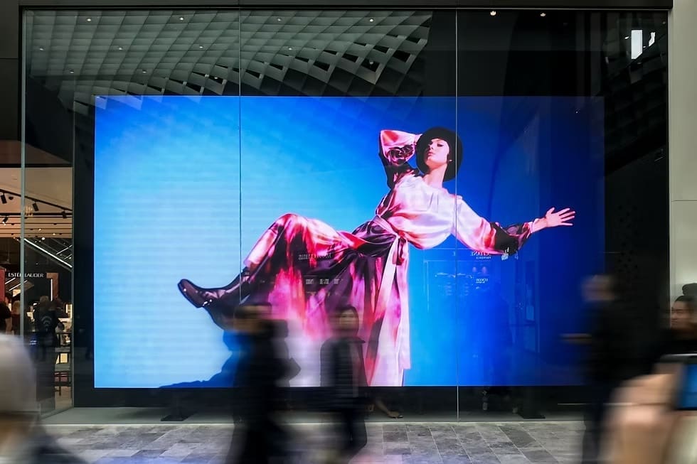 Transparent LED window display at David Jones store featuring high-resolution fashion visuals.