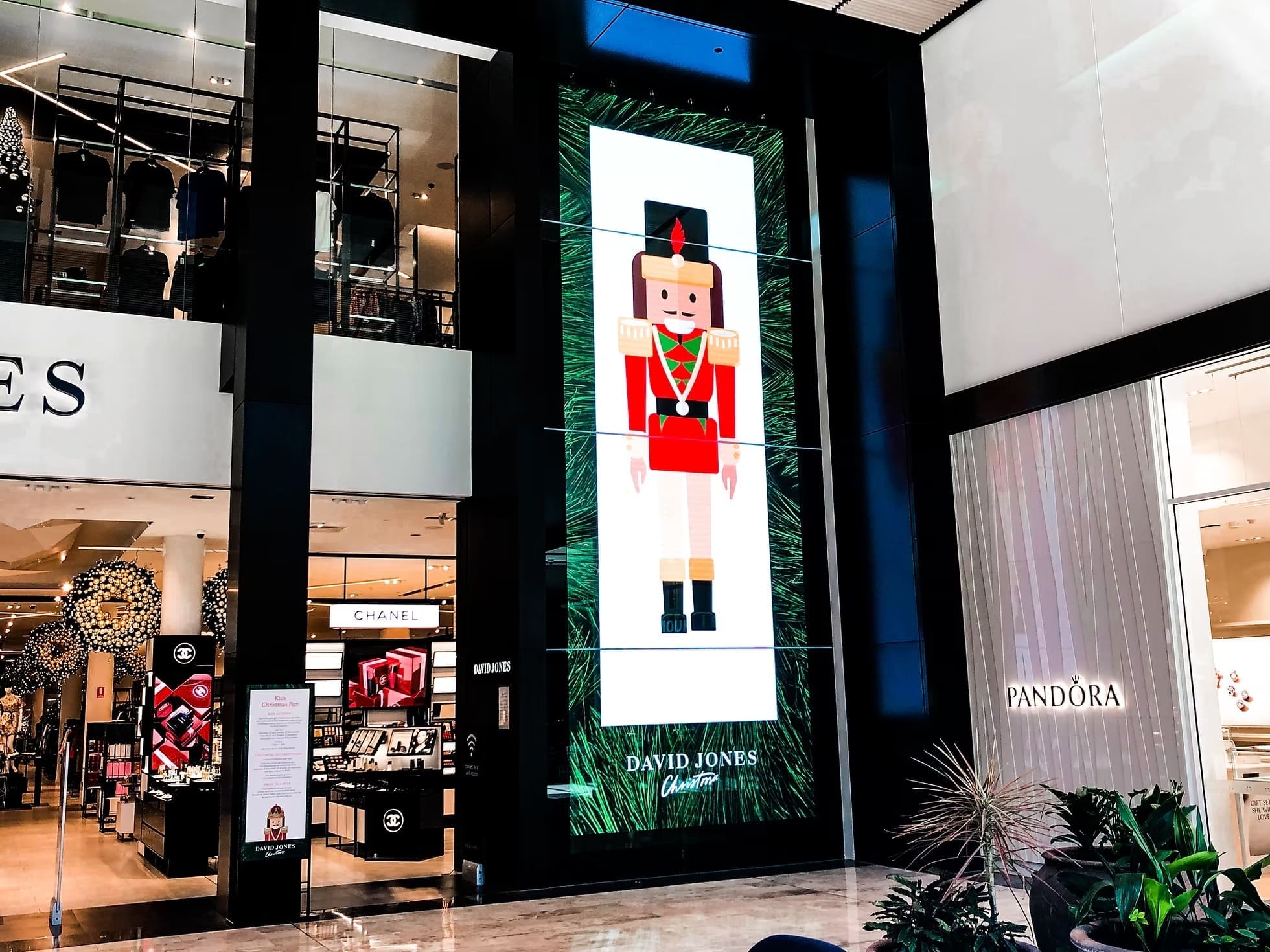Large vertical LED display at David Jones featuring a digital nutcracker design as part of a holiday campaign.